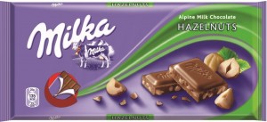 MILKA Czekolada mleczna z kawałkami orzechów laskowych 100g (pakowane 22 szt.)